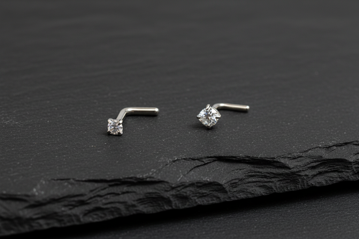 Silver nose ring with a small gemstone on a white background