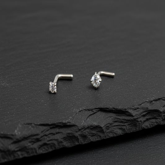 Silver nose ring with a small gemstone on a white background