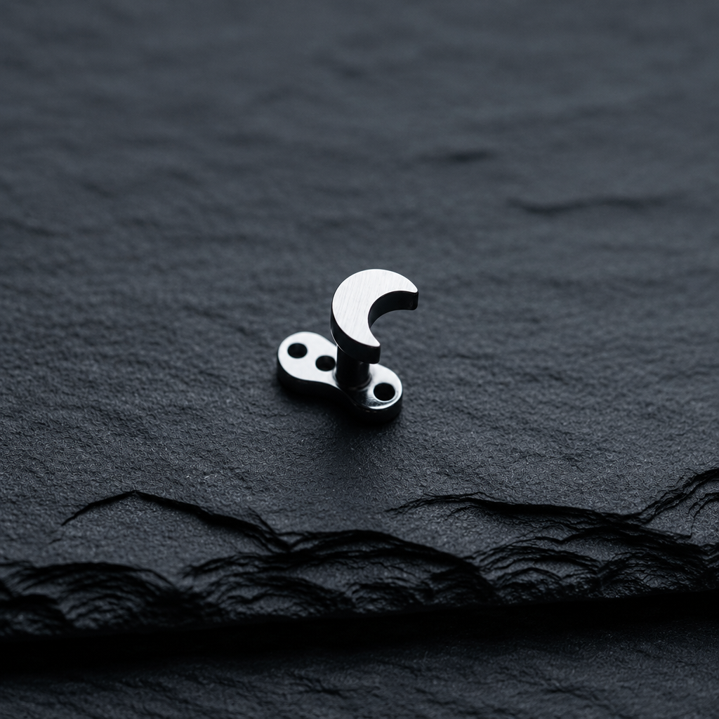 Crescent Moon Dermal Top on black rock