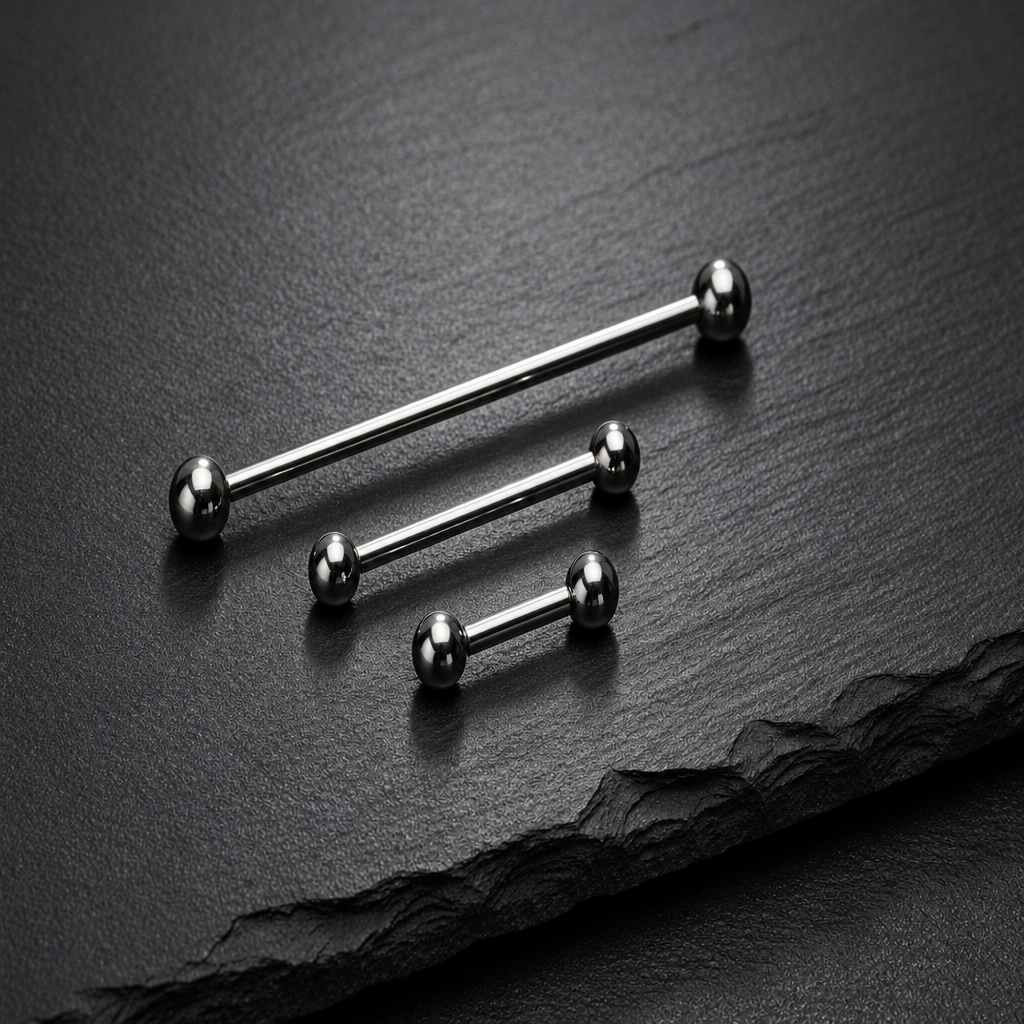 Three internally threaded straight barbells with ball ends on dark textured background