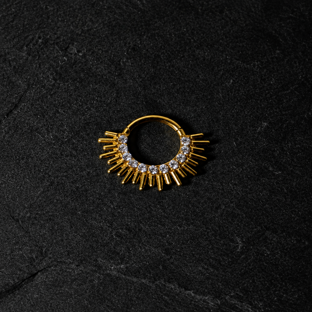 Luciana PVD Gold Clicker on black rock