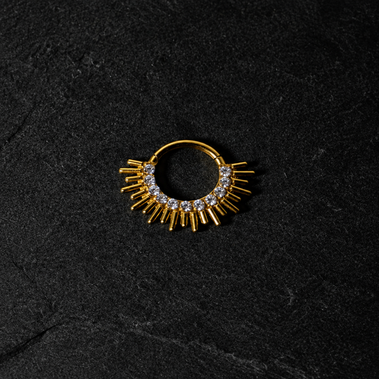 Luciana PVD Gold Clicker on black rock